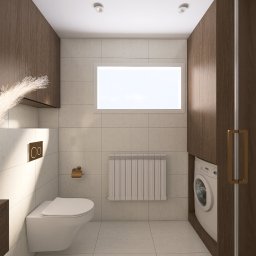 Zinna Interiors - Nowoczesna łazienka z pralką ukrytą w zabudowie, wiszącą toaletą i grzejnikiem pod oknem. Uwagę przykuwa dekoracyjna trawa pampasowa w wazonie.