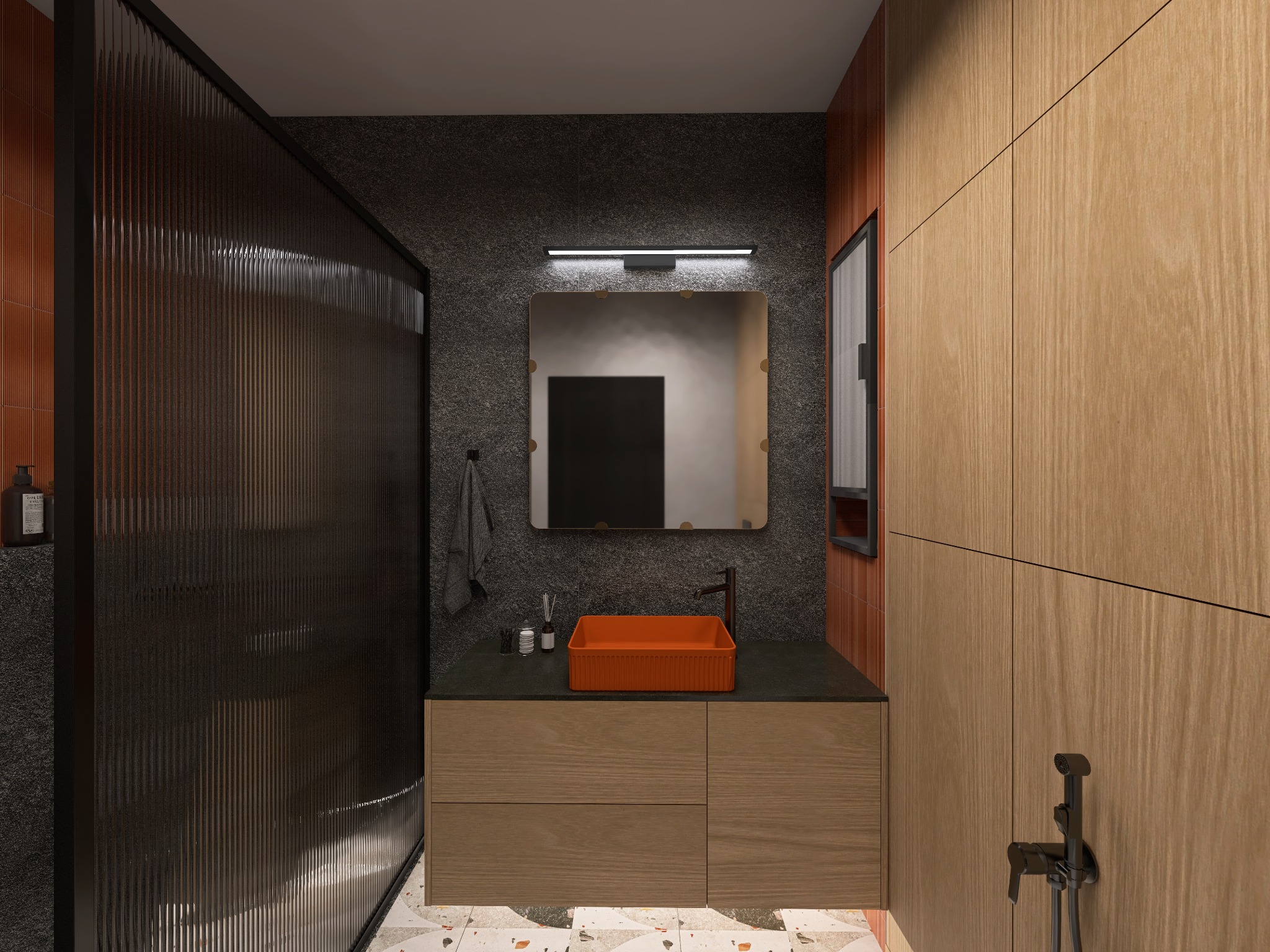 Nowoczesna łazienka z kabiną prysznicową oddzieloną ryflowaną szybą, pomarańczową umywalką na szafce z drewnianymi frontami i szarą ścianą z lustrem.