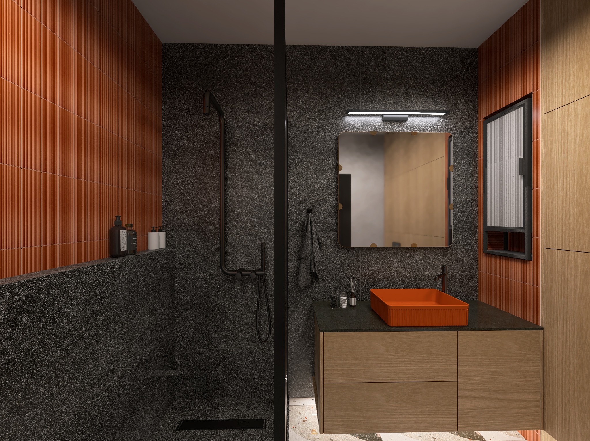 Nowoczesna łazienka z kabiną prysznicową typu walk-in, pomarańczową umywalką i płytkami w odcieniach terakoty. Minimalistyczne oświetlenie i armatura w kolorze czarnym.