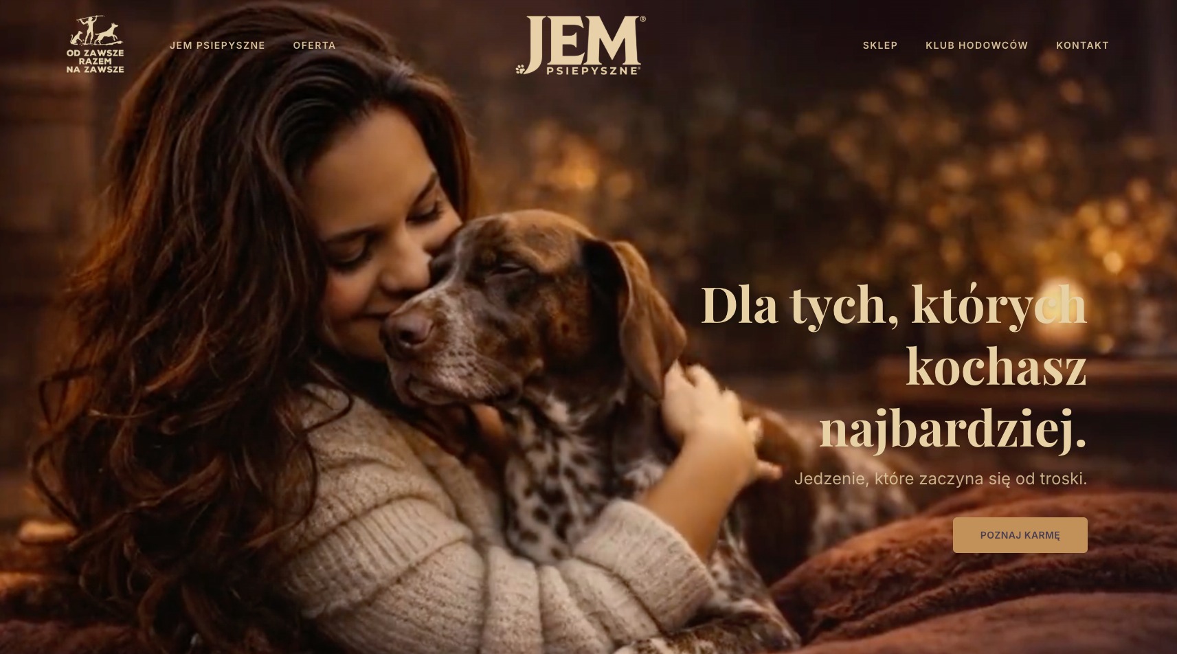 Strona internetowa marki JEM Psiepyszne z kobietą tulącą psa, hasłem 'Dla tych, których kochasz najbardziej' i przyciskiem 'Poznaj karmę'. Ciepła kolorystyka, profesjonalna fotografia.