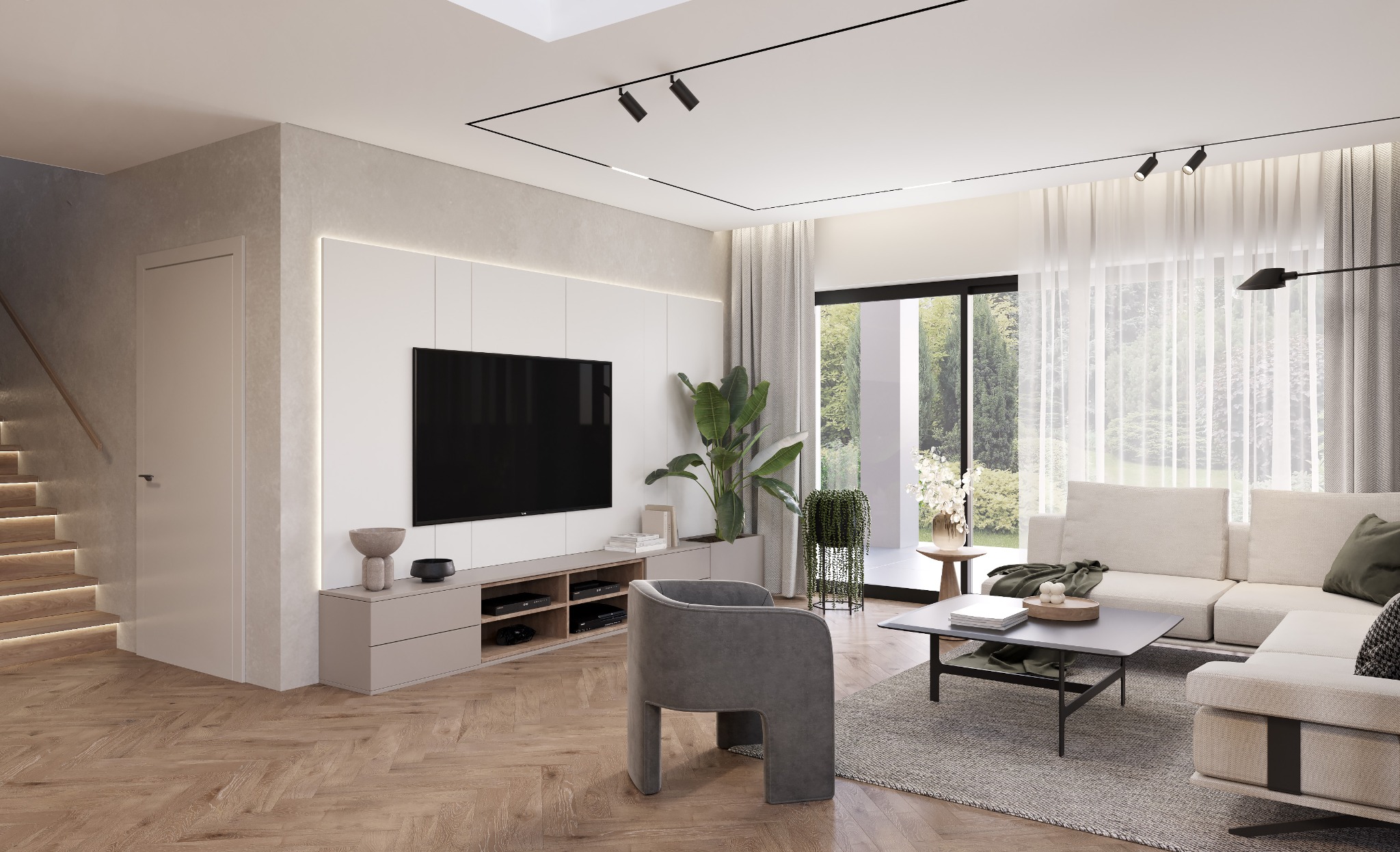 Jasne wnętrze salonu z parkietem w jodełkę, sofą narożną, szarym fotelem i ścianą TV z podświetleniem LED. Duże okno z widokiem na zieleń.