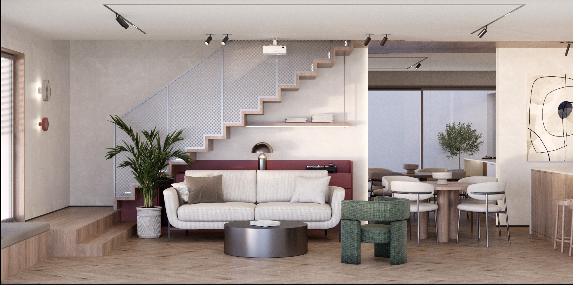 Nowoczesny salon z drewnianą podłogą w jodełkę, beżową sofą, okrągłym stolikiem i schodami z ażurową balustradą. Widoczny projektor na suficie i designerskie oświetlenie.