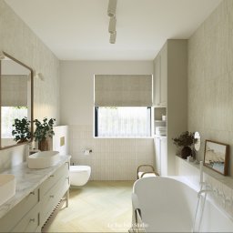 La Tua Isola Studio Julia Białaszewska - Jasna łazienka z dwoma umywalkami na blacie z marmuru, owalną wanną i beżowymi płytkami. Lustra w drewnianych ramach i subtelne oświetlenie.