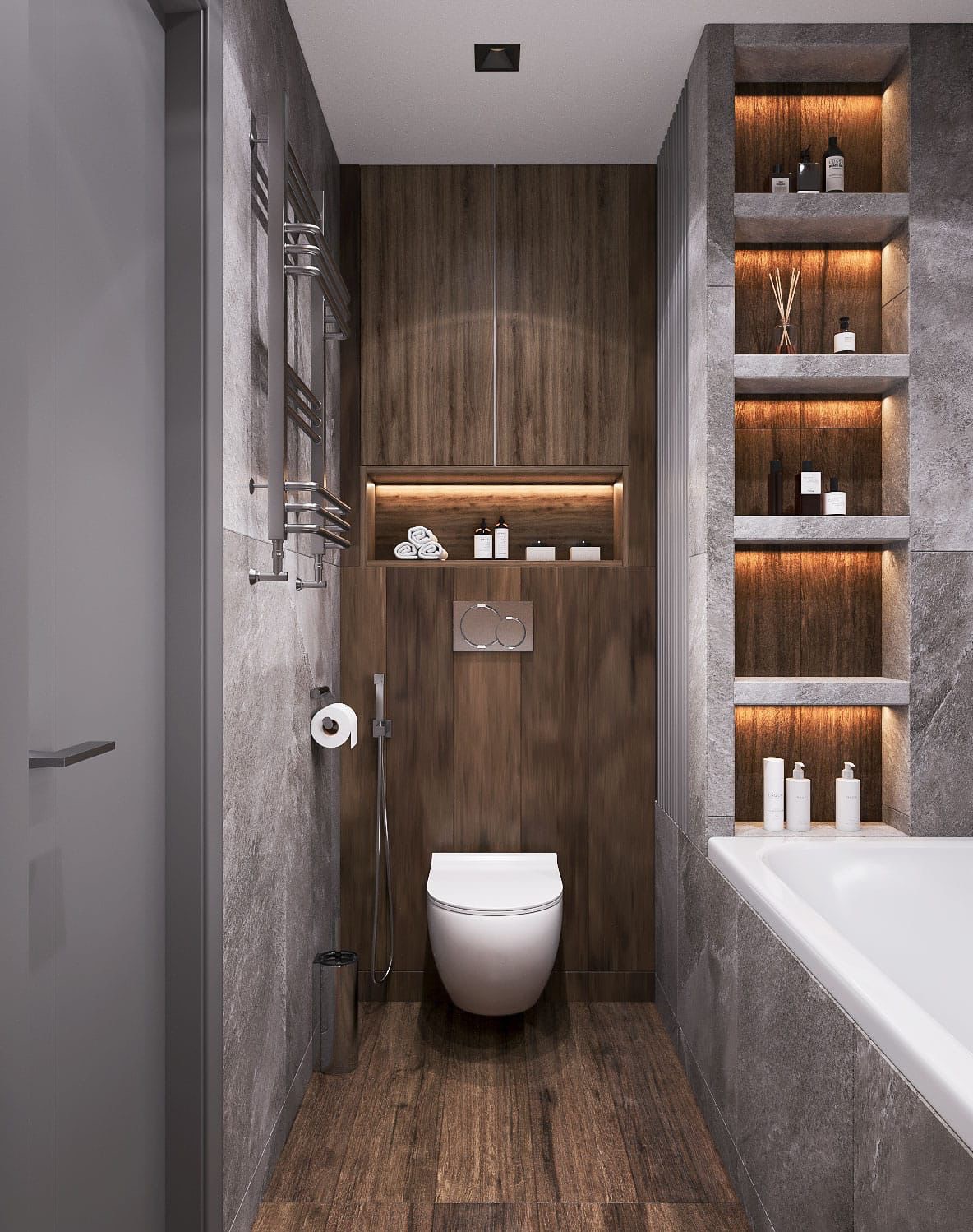Nowoczesna łazienka z drewnianymi akcentami: szafki, podłoga, oświetlone półki. Szara armatura i płytki imitujące kamień. Minimalistyczny design, wisząca toaleta.