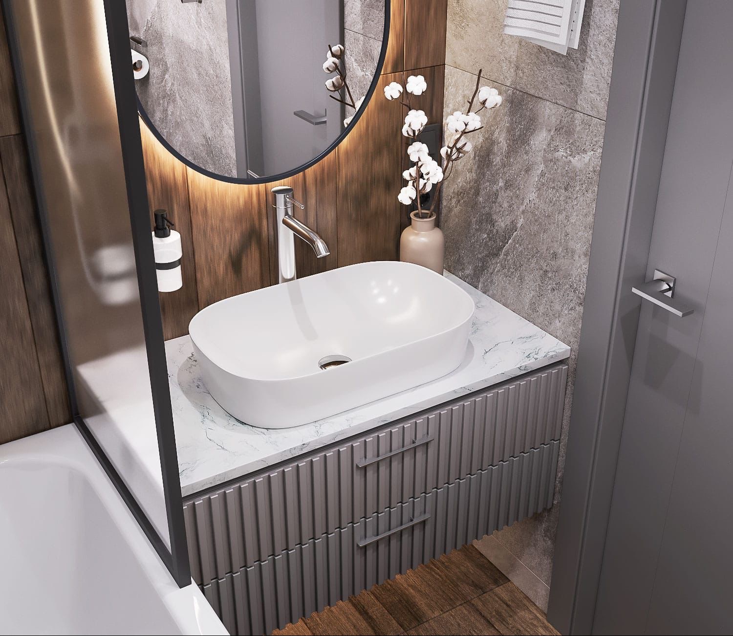 Nowoczesna łazienka z owalną umywalką nablatową, marmurowym blatem i szafką z ryflowanymi frontami. Okrągłe lustro z podświetleniem LED i dekoracyjne gałązki bawełny.