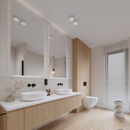 PRACOWNIA PROJEKTOWA WERONIKA STEFFEN-LOTARSKA - Nowoczesna aranżacja łazienki w Morągu: drewniane szafki pod umywalki, duże lustro z podświetleniem LED i minimalistyczna toaleta w zabudowie.