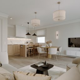 PRACOWNIA PROJEKTOWA WERONIKA STEFFEN-LOTARSKA - Jasne wnętrze z drewnianą kuchnią, okrągłym stołem i wygodną sofą. Minimalistyczny design z dbałością o detale, jak lampy i dekoracje. Widok na salon z perspektywy.