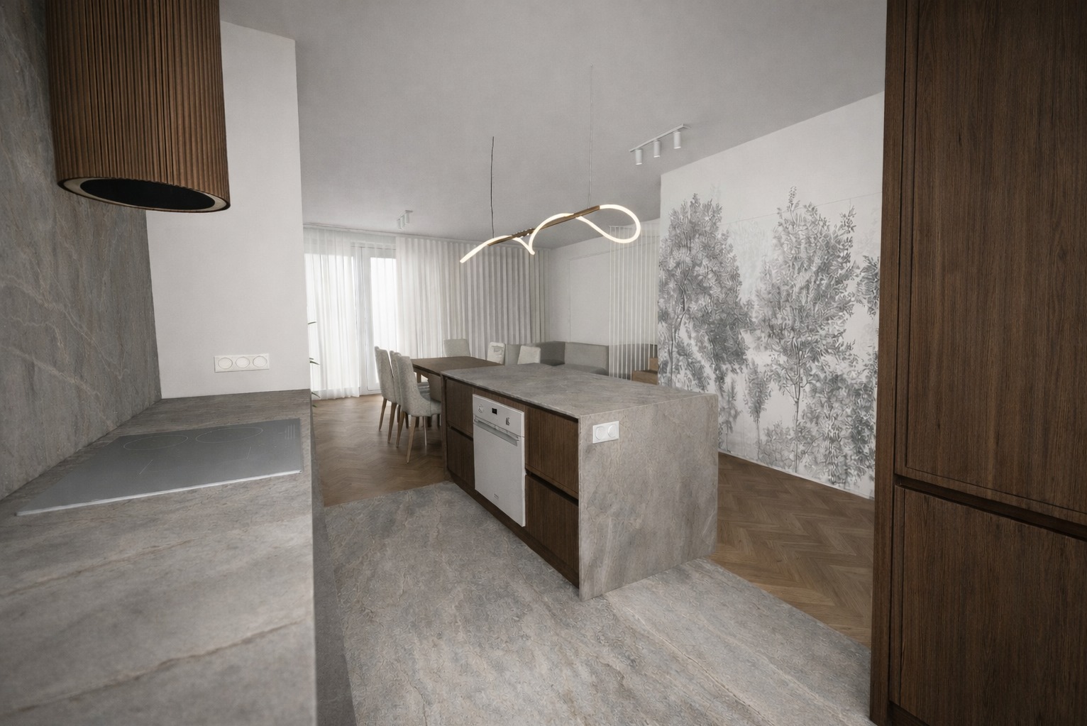 Nowoczesna kuchnia z wyspą, drewnianymi szafkami i blatem z szarego kamienia. W tle jadalnia z białymi krzesłami i tapeta z motywem drzew. Minimalistyczna lampa nad wyspą.