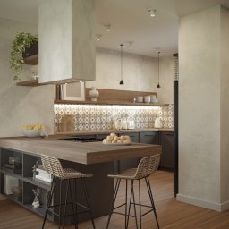 W&W GROUP SPÓŁKA Z OGRANICZONĄ ODPOWIEDZIALNOŚCIĄ - Nowoczesna kuchnia z wyspą i hokerami z rattanu. Na blacie owoce, w tle mozaika i oświetlenie LED. Minimalistyczny design z elementami rustykalnymi.