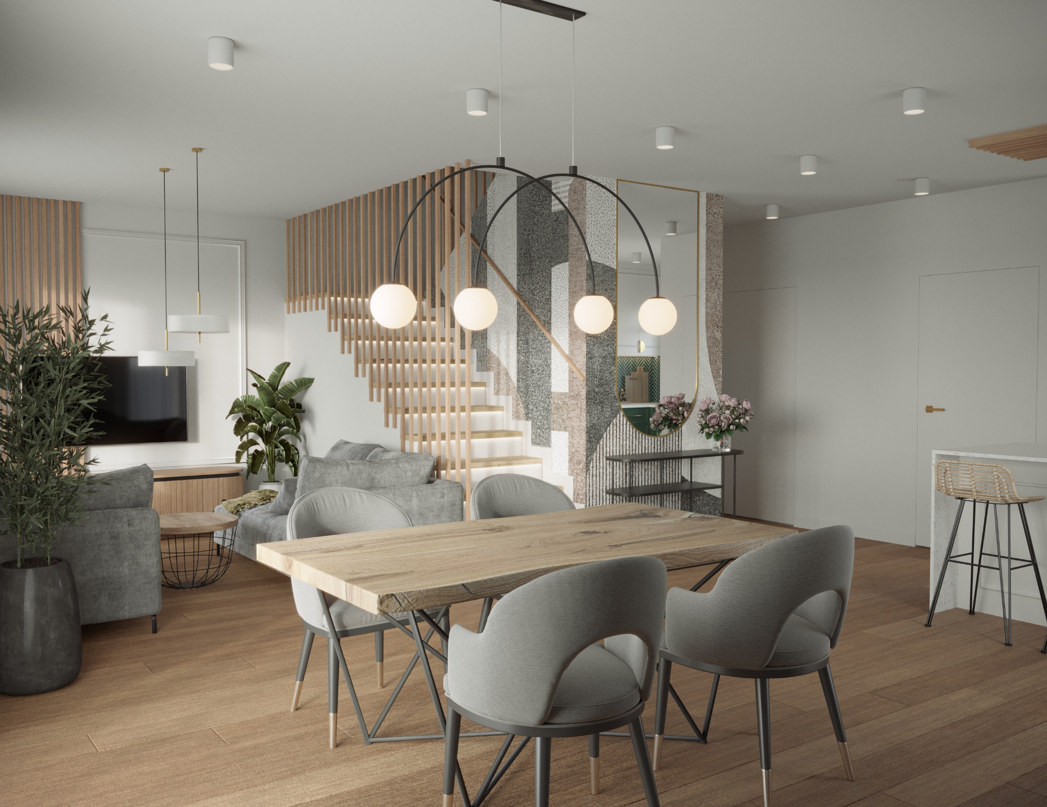 Jasne, przestronne wnętrze z drewnianym stołem i szarymi krzesłami. W tle schody z drewnianą balustradą i salon z szarą sofą. Nowoczesne oświetlenie punktowe.