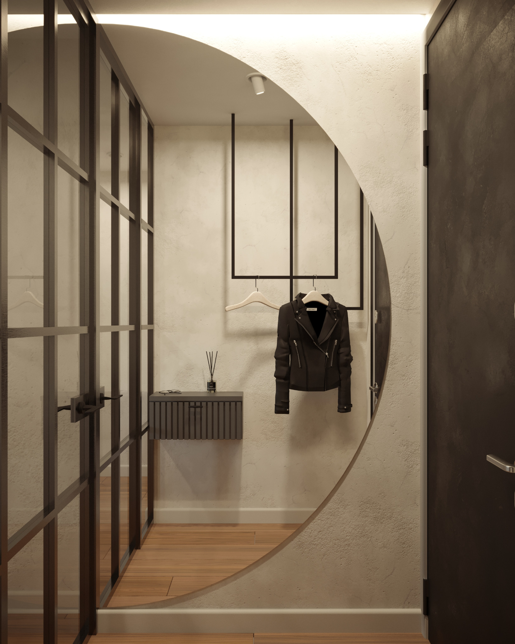 Nowoczesny przedpokój z lustrem w kształcie półksiężyca, czarną ramą i szklaną ścianką działową. Minimalistyczna szafka i wieszak z kurtką.