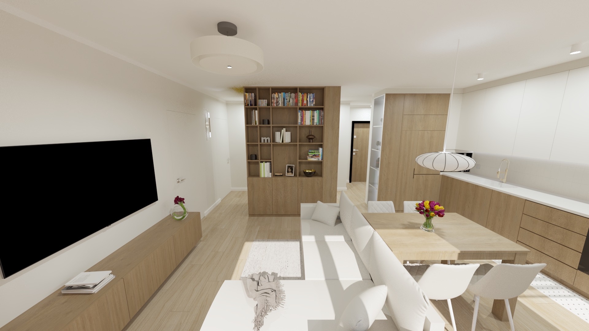 Wnętrze salonu z aneksem kuchennym w odcieniach beżu i bieli. Widoczny regał z książkami, sofa, stół z kwiatami i zabudowa kuchenna. Nowoczesny design.