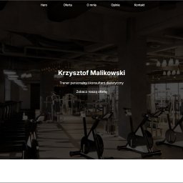 Jakub Kielbasa - Strona internetowa trenera personalnego z nagłówkiem prezentującym siłownię. Widoczne menu nawigacyjne i imię trenera. Stonowana kolorystyka, nowoczesny design.