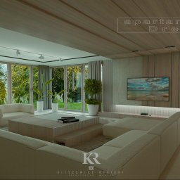 Kristobal Design - Wizualizacja salonu w apartamencie Dreźnie: beżowa sofa modułowa, drewniany sufit, duże okna z widokiem na zieleń, minimalistyczny design, oświetlenie punktowe.