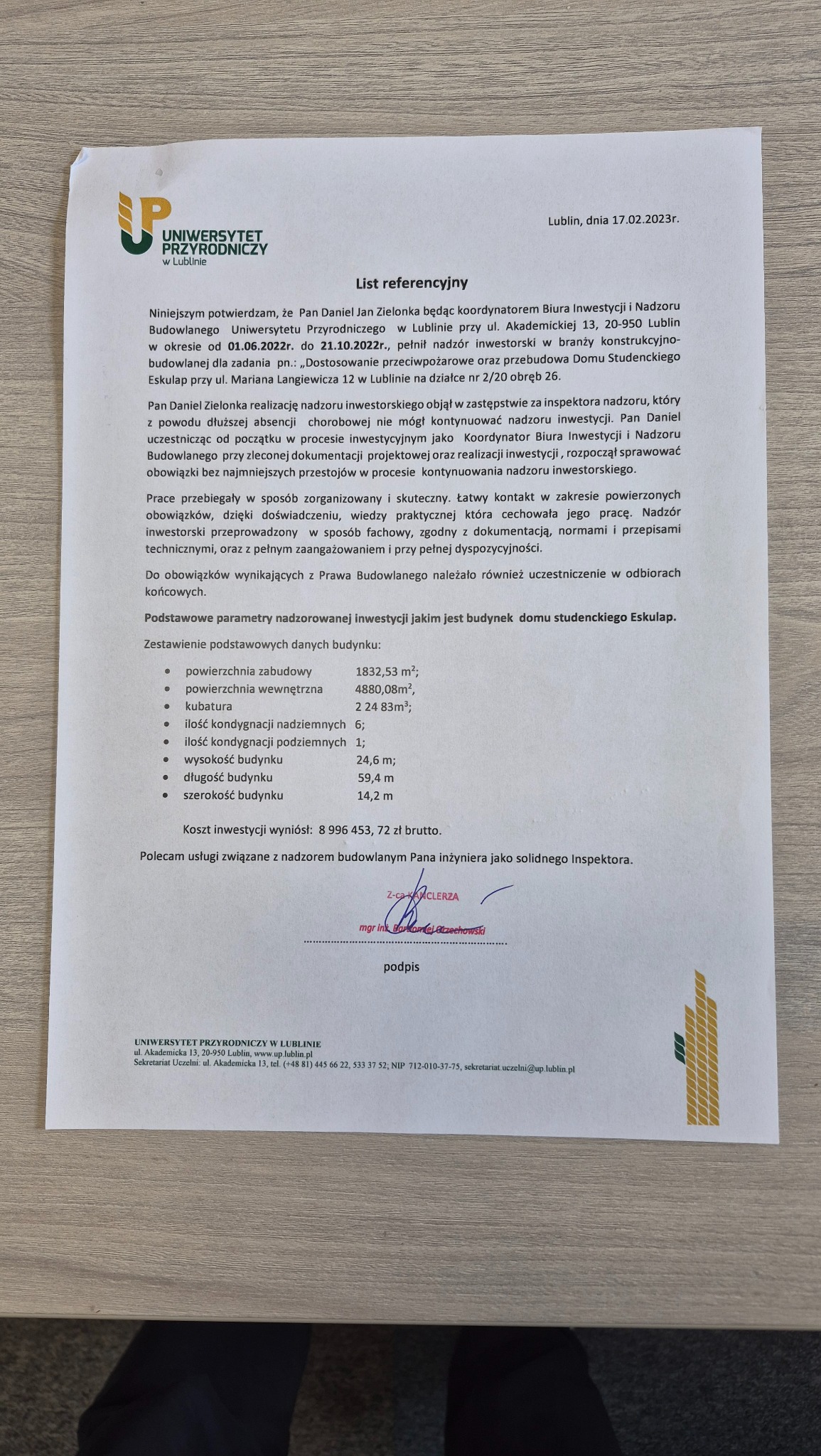 List referencyjny Uniwersytetu Przyrodniczego w Lublinie dla inżyniera budowlanego, potwierdzający nadzór inwestorski nad budową domu studenckiego Eskulap.