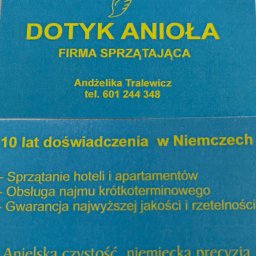 Dotyk Anioła - Wizytówka firmy sprzątającej 'Dotyk Anioła' z ofertą sprzątania hoteli i apartamentów, obsługi najmu krótkoterminowego oraz gwarancją jakości. Żółty tekst na niebieskim tle.