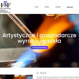 BossCats - Strona internetowa 'FISTEK GLASS' z sekcją główną ukazującą rzemieślnicze dmuchanie szkła, z płomieniem i rozgrzanym szkłem, oraz hasłem 'Artystyczne i gospodarcze wyroby ze szkła'.