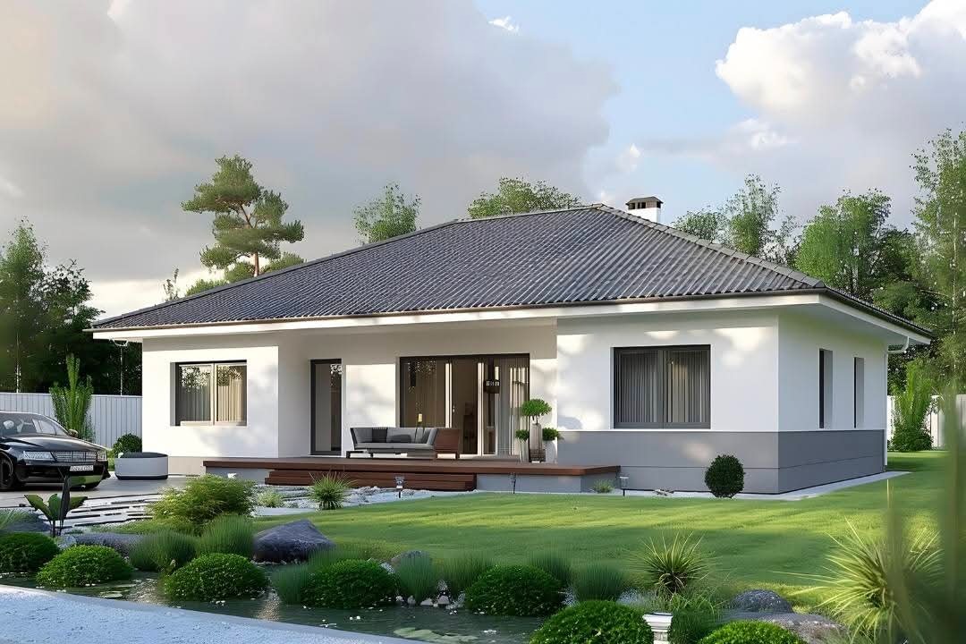 Parterowy dom z szarą dachówką, tarasem i zadbanym ogrodem. Nowoczesna architektura z dużymi oknami i przesuwnymi drzwiami tarasowymi. Elegancki samochód na podjeździe.