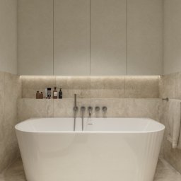 Karolina Kordyś Design - Beżowa łazienka z wolnostojącą wanną, minimalistycznymi szafkami i subtelnym oświetleniem LED. Umywalka z baterią ścienną. Neutralna kolorystyka, nowoczesny design.