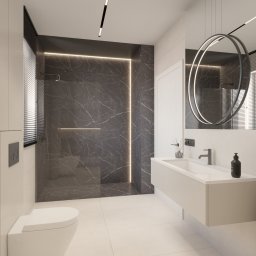 Karolina Kordyś Design - Nowoczesna łazienka z kabiną prysznicową wyłożoną płytkami imitującymi marmur, podświetloną listwą LED. Umywalka nablatowa z okrągłym lustrem i designerską lampą.