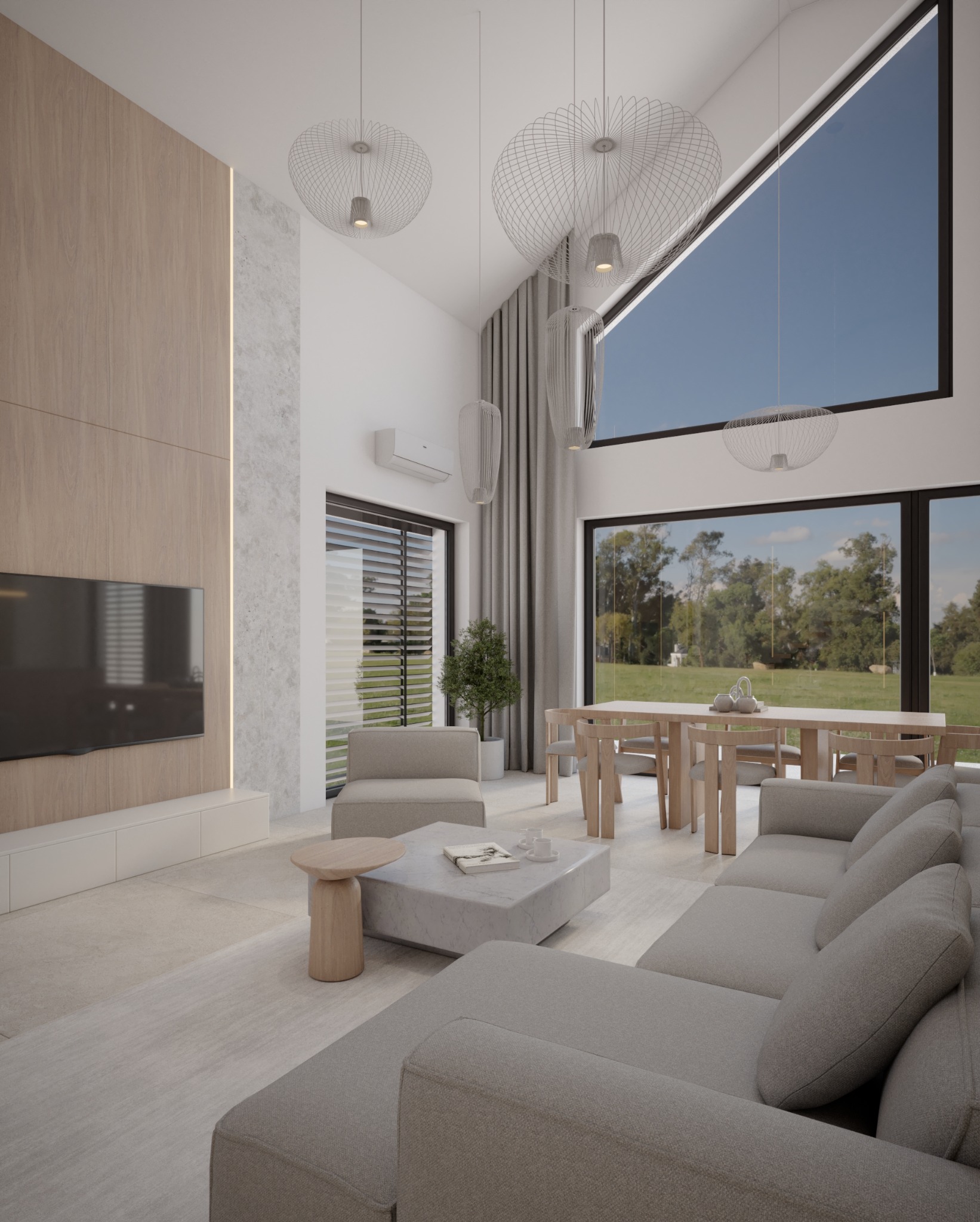 Jasne wnętrze salonu z dużym oknem i widokiem na zieleń. Minimalistyczny design z drewnianymi akcentami, szarą sofą i designerskimi lampami wiszącymi.