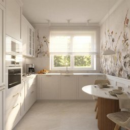 NOVA PRACOWNIA PROJEKTOWA KAROLINA PANFIL-KWIATKOWSKA, ARCHITEKT - Jasna kuchnia z białymi szafkami, marmurowym blatem i okrągłym stołem. Na ścianie dekoracyjny motyw roślinny. Nowoczesny ekspres do kawy i owoce na blacie.