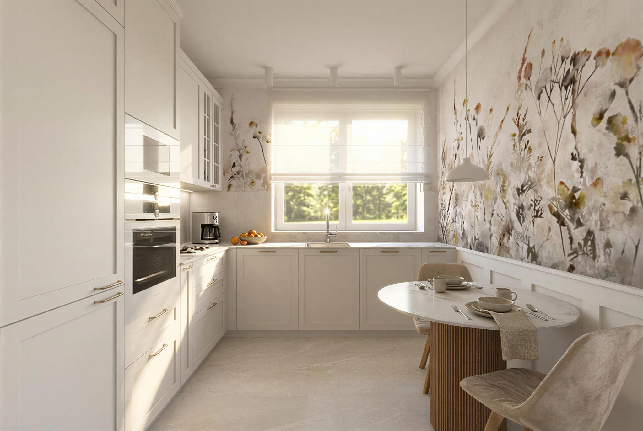 Jasna kuchnia z białymi szafkami, marmurowym blatem i okrągłym stołem. Na ścianie dekoracyjny motyw roślinny. Nowoczesny ekspres do kawy i owoce na blacie.