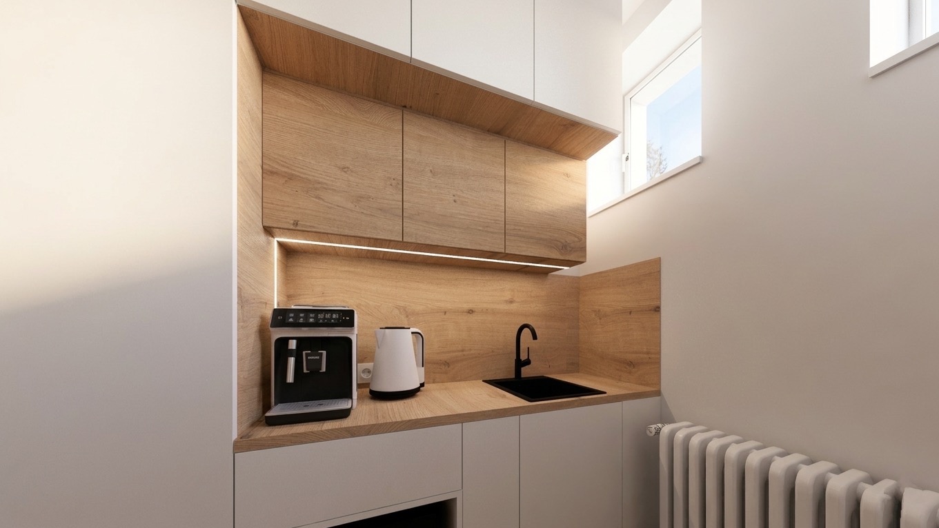 Nowoczesna kuchnia z drewnianymi szafkami, białymi frontami i oświetleniem LED. Na blacie ekspres do kawy i czajnik. Minimalistyczny design z grzejnikiem w tle.