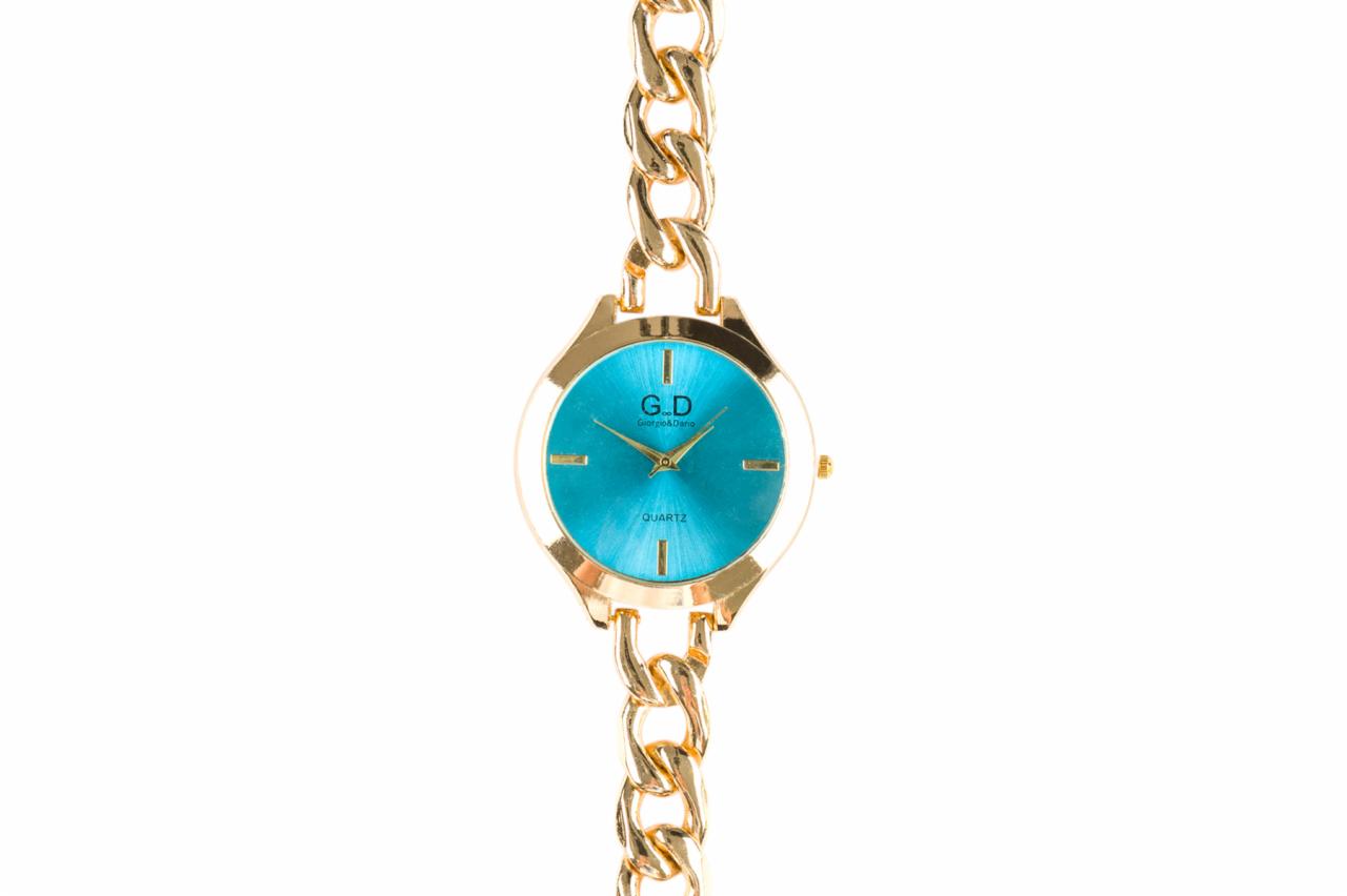 Złoty zegarek damski z turkusową tarczą na łańcuszku, marki Giorgio&Dino, na białym tle.