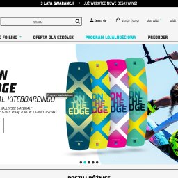 BoostNow Agencja Marketingowa - Zrzut ekranu strony SU-2 BOARDS FACTORY z nagłówkiem, menu i głównym banerem. Prezentuje on cztery kolorowe deski kitesurfingowe 'NEW ON THE EDGE' oraz kitesurfera w dynamicznej pozie.