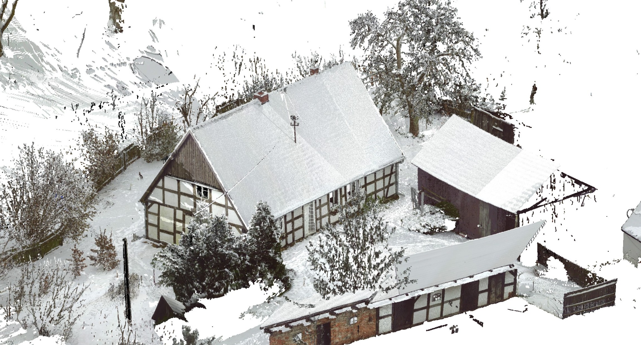 Skan 3D zimowego krajobrazu z domem szkieletowym i zabudowaniami gospodarczymi, pokrytymi śniegiem. Widok z góry, ukazujący detale konstrukcji i otoczenia.