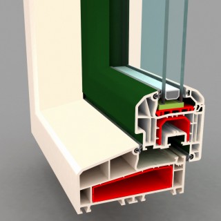 Przekrój poprzeczny okna z tworzywa sztucznego, ukazujący jego wielokomorową konstrukcję, uszczelki i profil. Widoczne elementy w kolorze białym, zielonym i czerwonym. Szara powierzchnia w tle.