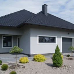 Nowoczesny dom jednorodzinny z szarą elewacją, grafitową dachówką i zadbanym ogrodem z ozdobnymi krzewami.