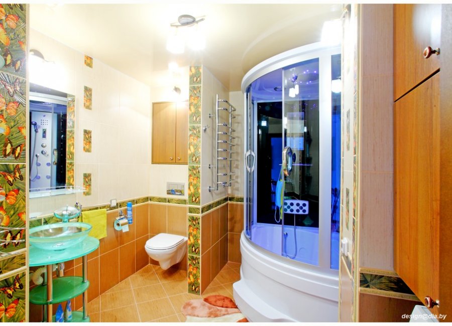 Wykończona łazienka w Sielsku z kabiną prysznicową z niebieskim podświetleniem, umywalką na szklanym blacie i płytkami z motywem motyli.