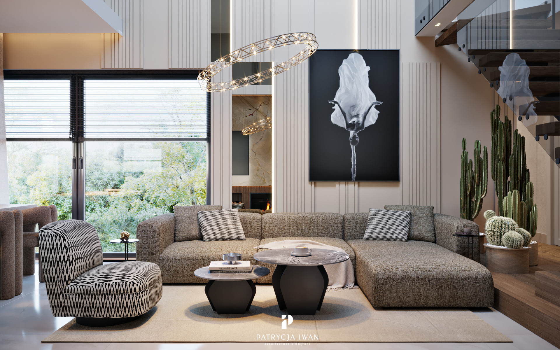 Salon z narożnikiem, okrągłym żyrandolem i czarno-białym obrazem. Widoczne schody z drewnianymi stopniami i kaktusy. Nowoczesne wnętrze z elementami dekoracyjnymi.