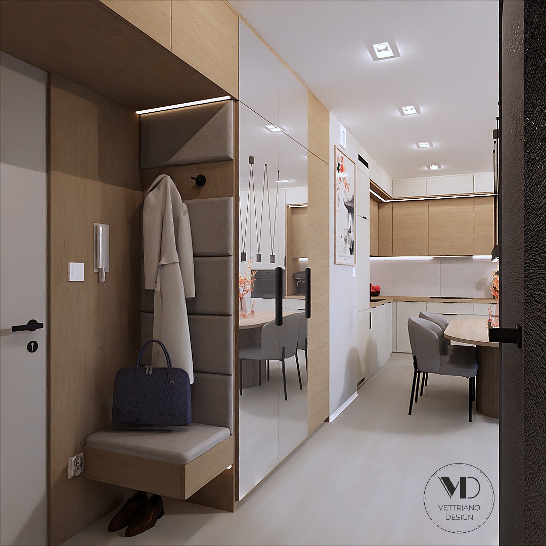 Nowoczesny przedpokój z siedziskiem i wieszakiem, lustrzane drzwi szafy odbijają jadalnię i kuchnię, minimalistyczne oświetlenie, brązowe skórzane buty pod siedziskiem.