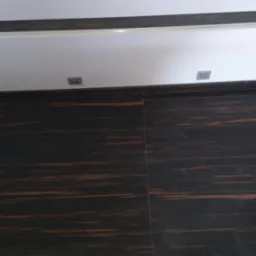 Ciemna, drewnopodobna terakota na podłodze i ścianie, z widocznymi punktami świetlnymi w suficie, tworząca nowoczesne wykończenie wnętrza.