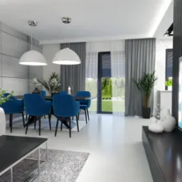 Nowoczesna jadalnia z ciemnym stołem, sześcioma niebieskimi krzesłami obitymi aksamitem, dwiema białymi lampami wiszącymi i betonową ścianą w tle, widok z salonu z szarym dywanem i telewizorem...