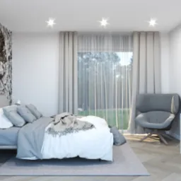 Neutralna sypialnia z fototapetą przedstawiającą postać kobiety, szara pościel i fotel na tle okna z zasłonami.