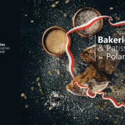 Dark food photography featuring rye bread, bowls of salt and sugar, pumpkin seeds, and a stylized Polish flag ribbon, for a bakeries and patisseries in Poland campaign.